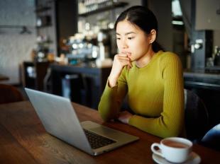 woman looking at computer screen