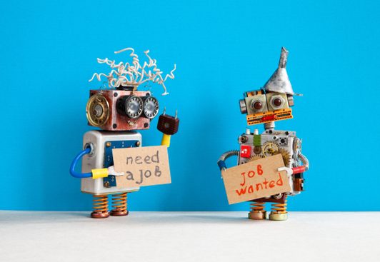 two robots hold up signs advertising for jobs