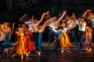 Long exposed and colorful photo of the dancers performing their art in a musical.