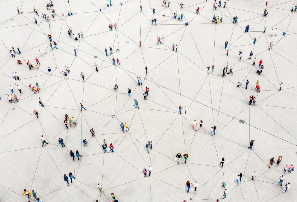 Aerial view of a crowd connected by lines.