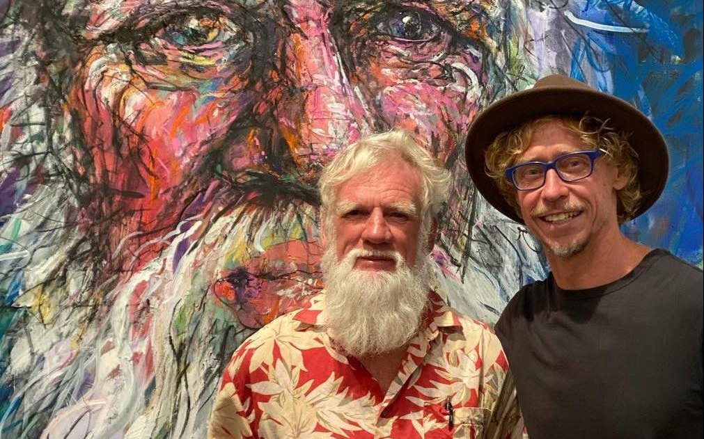 Artist Craig Ruddy with writer Bruce Pascoe in from of portrait painting.