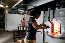 Woman working in JamFactory glass workshop.