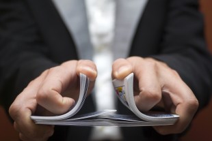 Man shuffling a deck of cards.