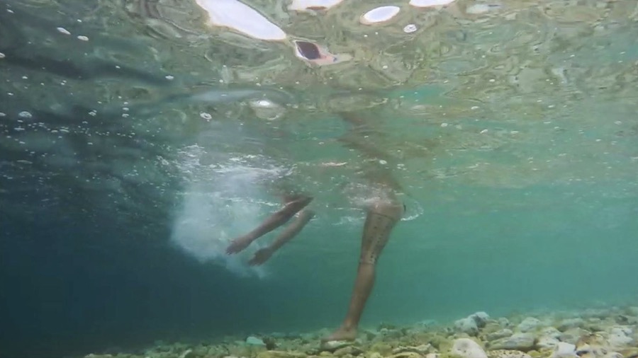Angela Tiatia video still Lick, body immerse in water