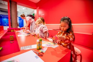 Child making art at NGV.