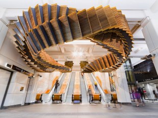 artwork in train station over escalators by Chris Fox