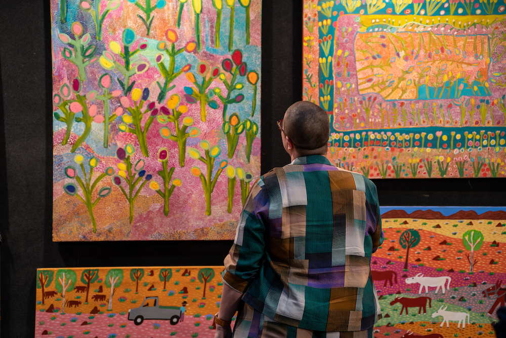 Man looking at Aboriginal art at DAAF