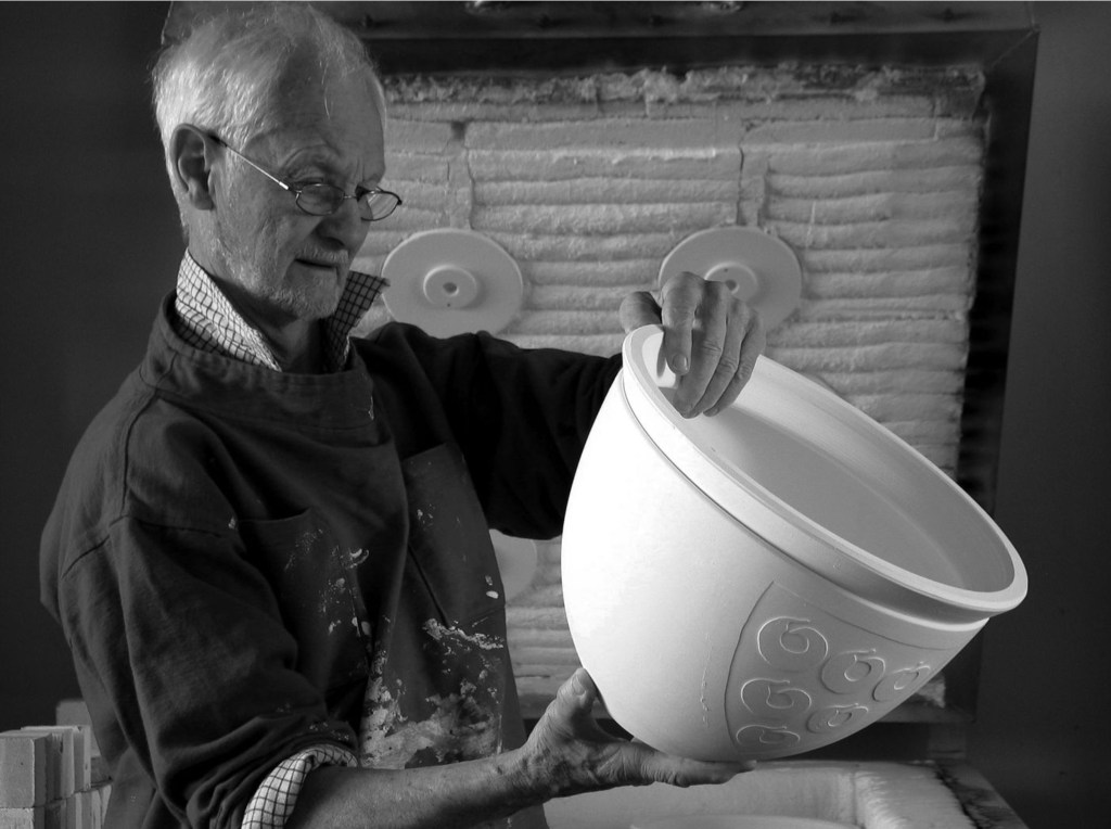 ceramicist Les Blakbrough holding a pot