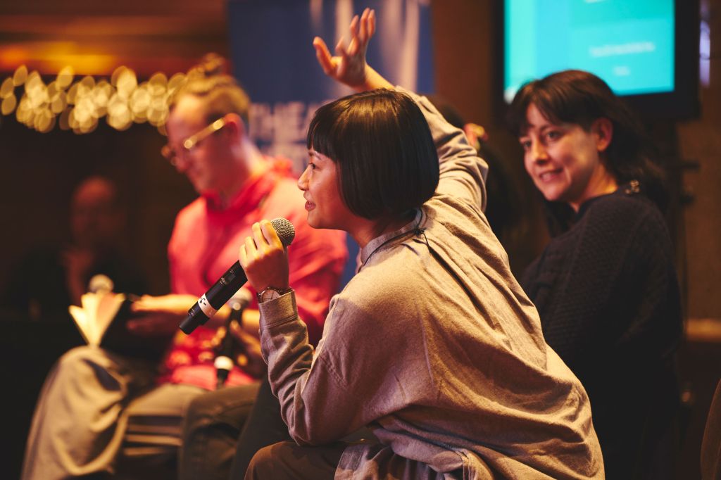 woman talking on panel about mental health in Arts