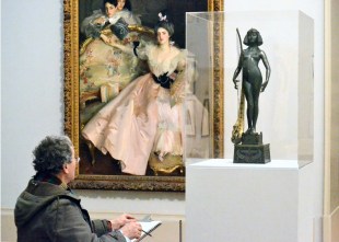 An artist sketching at Tate Britain