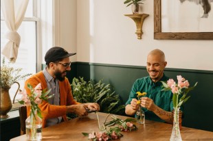 two men arranging flowers in their home Airbnb hosts