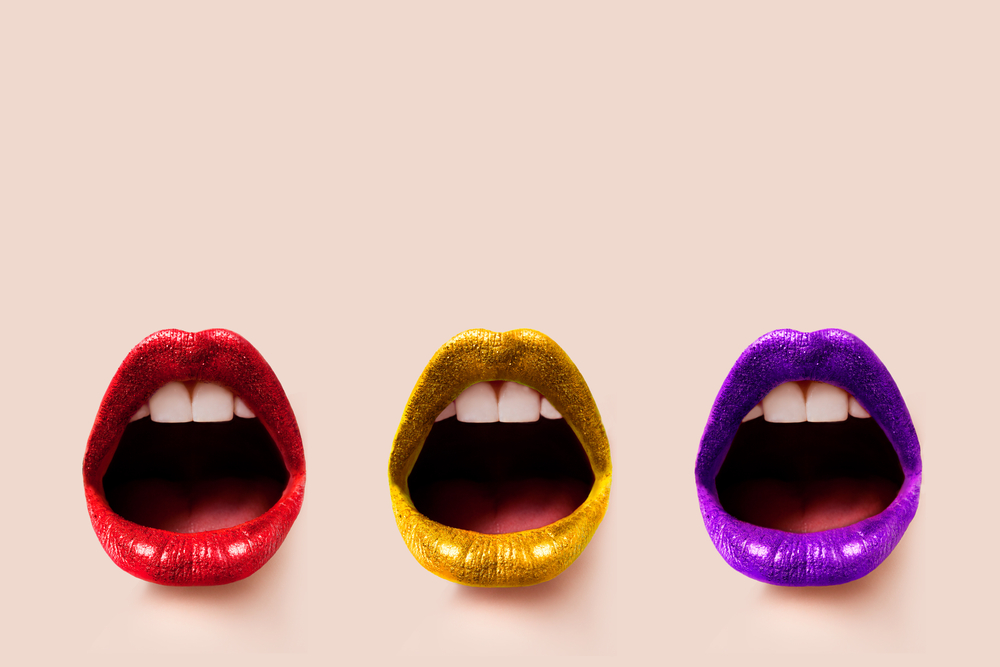 lips with bright coloured lipstick on beige background