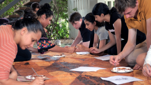 Community members making craft at a table