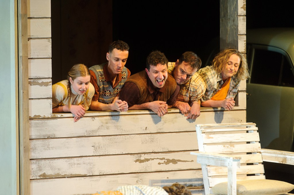 My Sister Jill. A group of five adults dressed as children leaning out from a window with their hands on the sill.