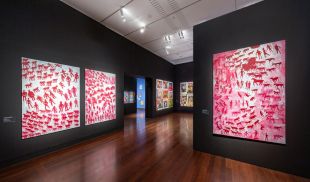 Tarnanthi 2023, Art Gallery of South Australia, Adelaide, installation view, showing three largescale red and white paintings.