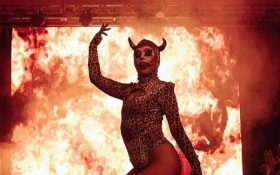 Disaster. Image is of ‘Le Freak’ at Melbourne Fringe Festival 2023, with a backdrop of flames behind a devilish figure with horns and one arm raised.