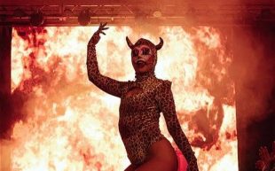 Disaster. Image is of ‘Le Freak’ at Melbourne Fringe Festival 2023, with a backdrop of flames behind a devilish figure with horns and one arm raised.