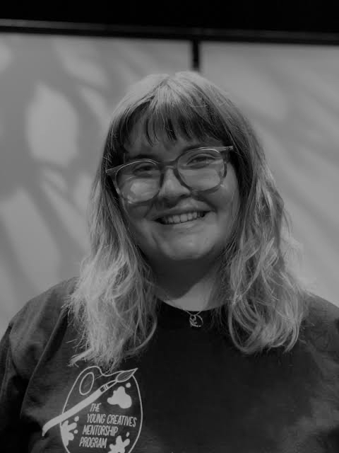 other work. Black and white image of woman with shoulder length fair hair, glasses and black jumper.