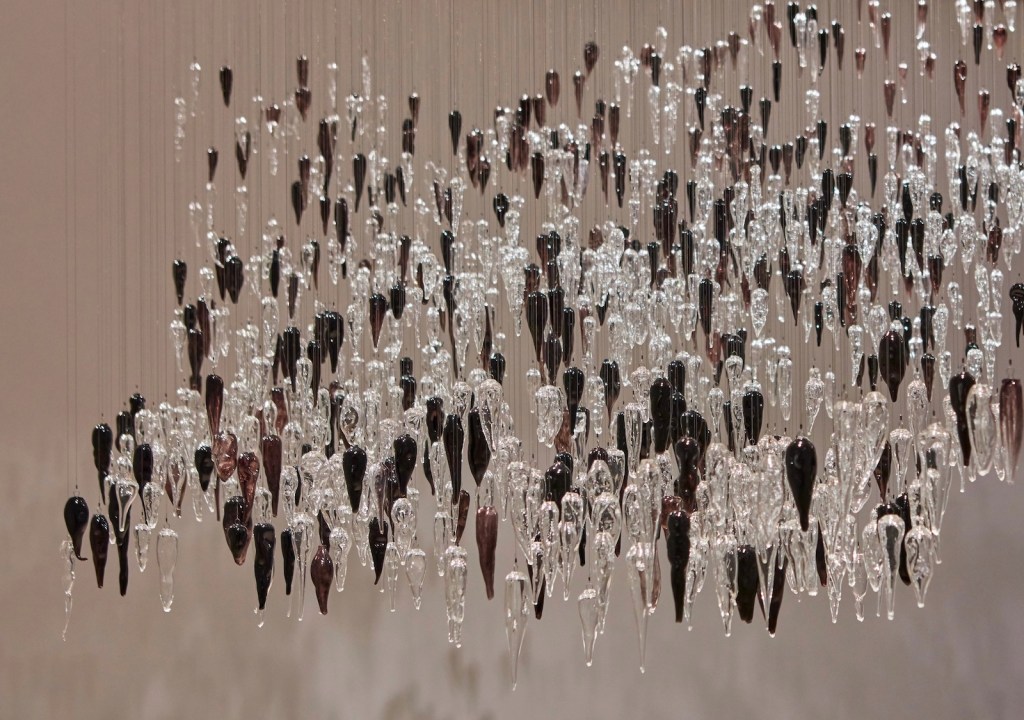 Yhonnie Scarce. Image is suspended yam forms made from glass in black and clear.