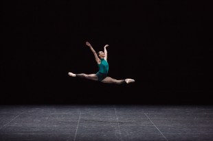 arts appointments. Image is a leaping female ballet dancer with legs in a perfect mid air split.