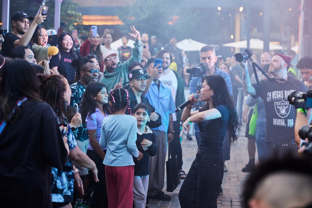 Hip Hop performer singing to crowd in Western Sydney