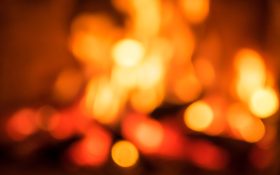 wet blanket. image is an abstract blurry image of flames.