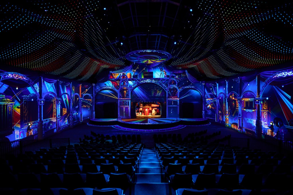 projected imagery around a venue recreating a circus like environment.