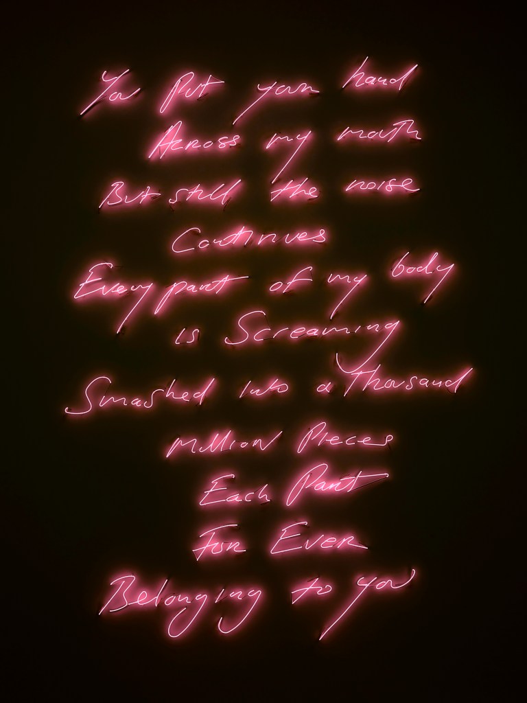 Tracey Emin, ‘Love Poem for CF’, 2007, currently on display as part of the 'NGV Triennial'. Proposed acquisition with the support of Jo Horgan and Peter Wetenhall. Image: Tracey Emin. Photo: White Cube (Ollie Hammick). Pink neon words on a black background that reads ‘you put your hand | across my mouth | but still the noise | continues | every part of my body | is screaming | smashed into a thousand | million pieces | each part | for ever | belong to you’