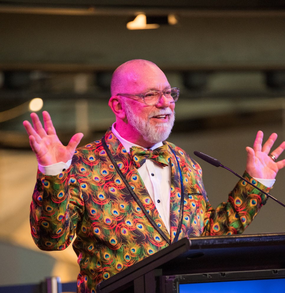 man with beard and bright patterned jacket given talk. Craig Donarski.