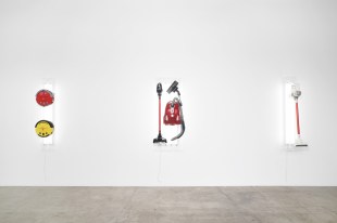 David Attwood, ‘Post New Hoover Magic Stick and Hoover Aura II’, 2023. Hoover Magic Stick vacuum, Hoover Aura II vacuum, fluorescent lights, acrylic. Photo: ArtDoc, courtesy of the artist. A white wall gallery displaying artworks that appear to be household vacuums.
