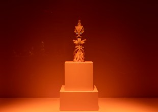 Orange glazed ceramic sculpture in orange painted gallery. Mai Nguyen Long