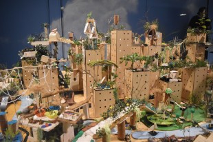 ArtPlay. miniature city made of cardboard with animals and trees.