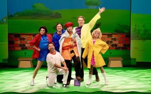 'You're a Good Man, Charlie Brown' at Geelong Arts Centre. Photo: Michael Mason. Six performers dressed in colourful attire on stage with the background of a cartoonish park. They are posing in a group with happy and cheeky expressions.