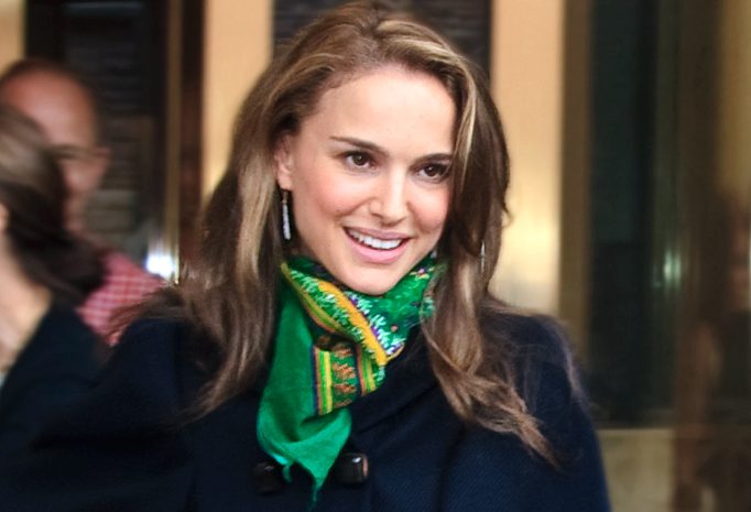 method acting, Natalie Portman. Image is a 39-something female actor in a blue double breasted blazer and green scarf, with long hair, smiling off camera.