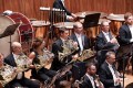 SSO, season opening gala, image shows an orchestra and focuses on a row of French horn players.
