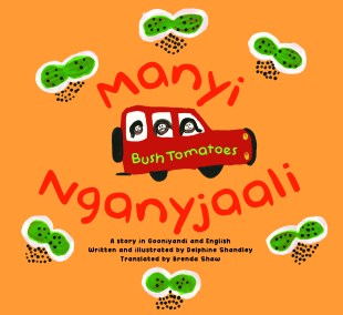 A children's book titled 'Manyi Nganyjaali' by Delphine Shandley. The orange cover has three people in a red car with 'bush tomatoes' written across it.