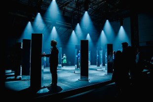 Light installation with blue tones and people interacting. Vivid Sydney.