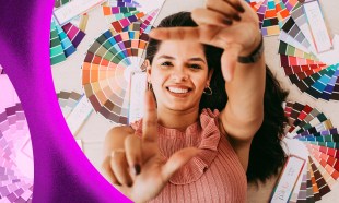 A young woman reaches out to the camera with her fingers making a frame. The background is an artist's colourwheel.