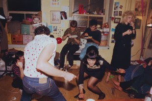 Nan Goldin. A group of people dancing the twist in a room.