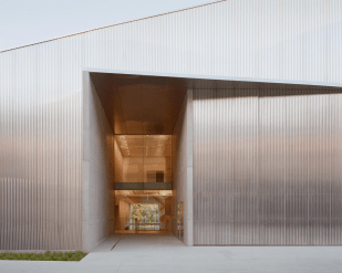 Powerhouse Castle Hill. Image: Rory Gardiner. The front entrance to Powerhouse Castle Hill, featuring a minimalistic silver-panelled architecture and large glass doors that also reveals the second floor.