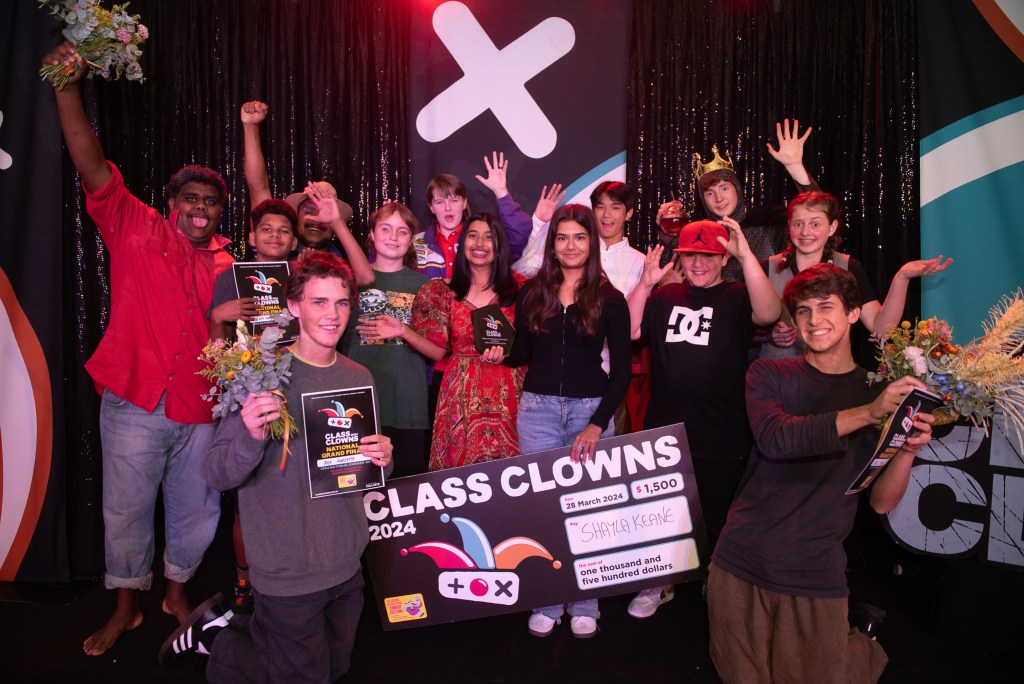A group of teenage comedians gather around Shayla Keane, the winner of the Class Clowns competition hosted by the Melbourne International Comedy Festival. 