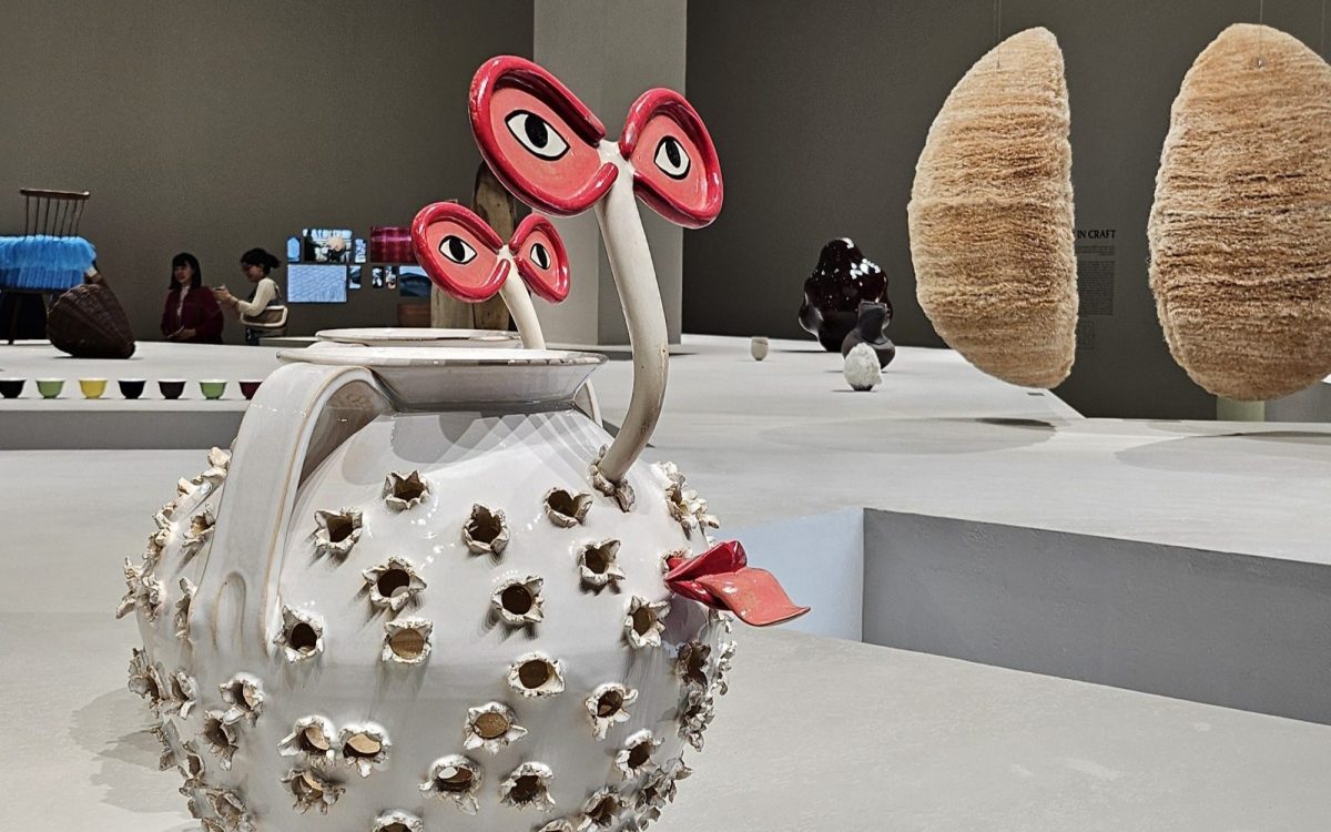Works shown as part of ‘LOEWE Crafted World’ at Shanghai Exhibition Centre. Ceramic chestnut roasters by Laia Arqueros. Photo: ArtsHub. A playful pair of ceramic chestnut roasters with eyes and a tongue poking out. It’s placed on a large exhibition platform alongside other objects on display.