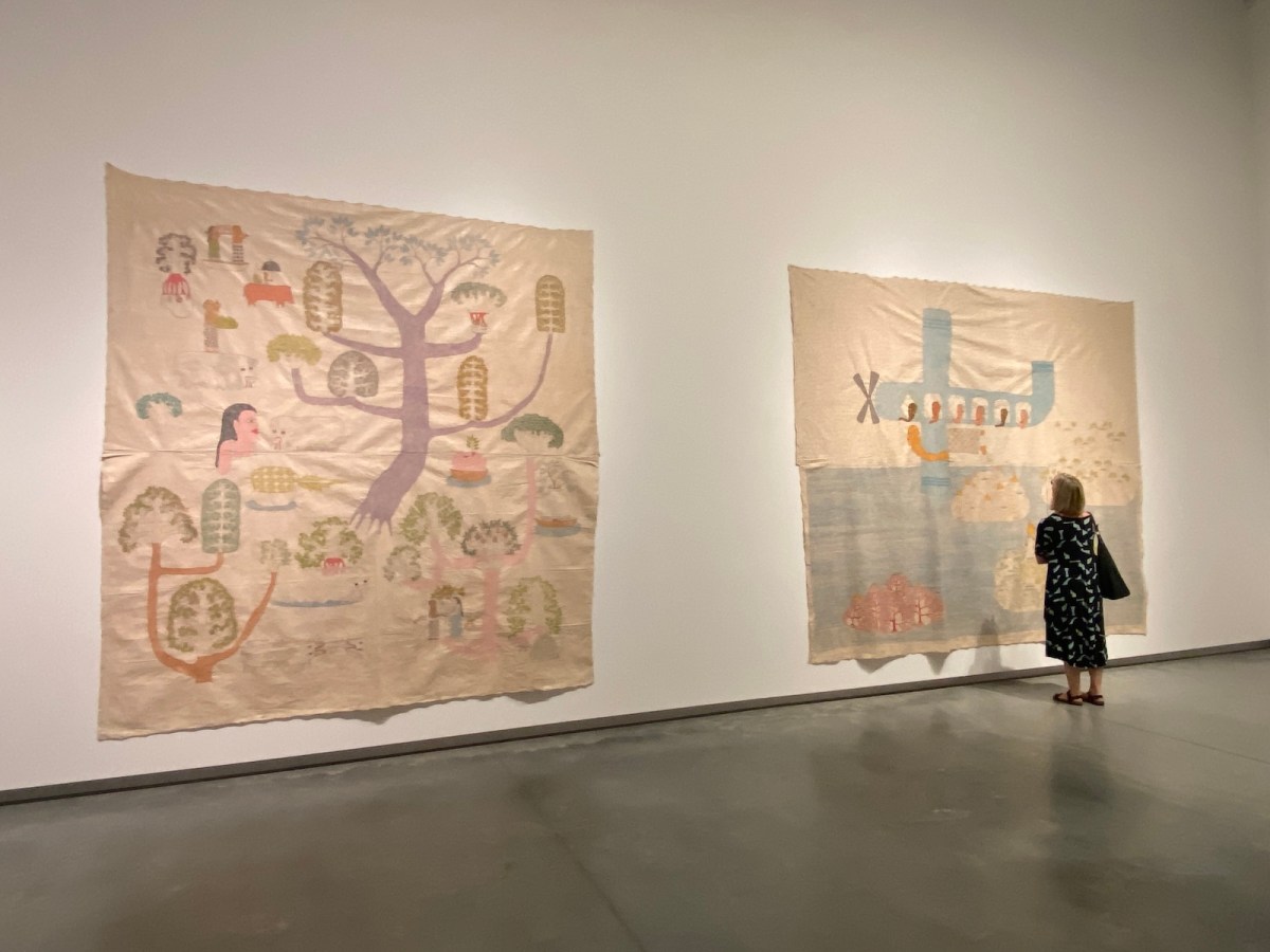 Woman in gallery looking at contemporary Indonesian textiles. Jumaadi, Bundanon