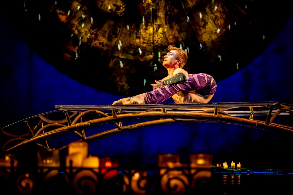 Luzia Cirque du Soleil, A contortionist lies on a bridge in a terrifying shape.