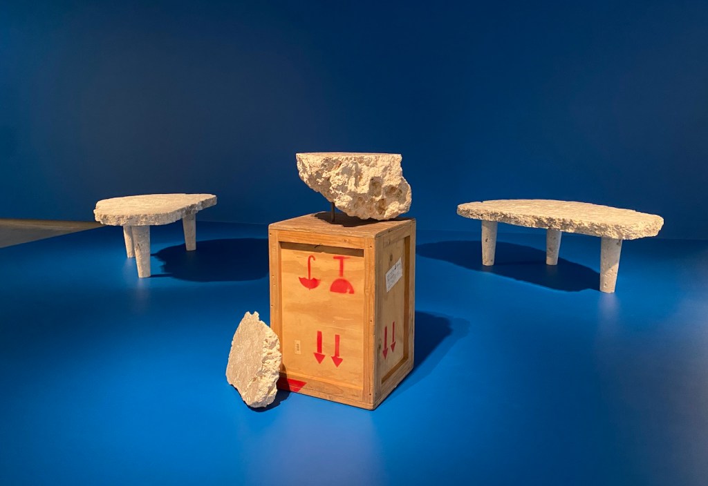 Sculpture display of tables made from white stone. Nicholas Mangan.