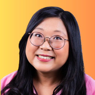 Jennifer Wong. Image is a headshot of a smiling woman of Asian appearance wearing glasses. She has long dark hair and a side parting, plus a pink shirt. Her head is slightly tilted to the right.