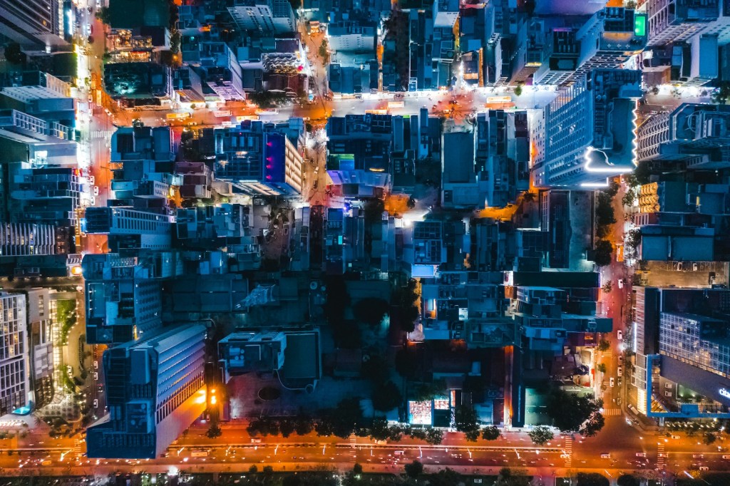 Aerial view of a city at night. Architect.