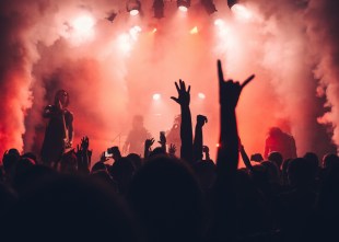 Music concert with red smoke and lighting.