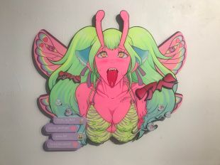 Izzy Faith V. Image is a 3D illustration of a demon woman with pink wings and antennas and an abundance of green hair. She is sticking her tongue out.