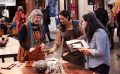 Craft Lab returns to Ballarat Mining Exchange as part of Ballarat Heritage Festival. Photo: Supplied. Three woman gathering near a timbre table displaying round crafts vases. They are in a bustling indoor environment.